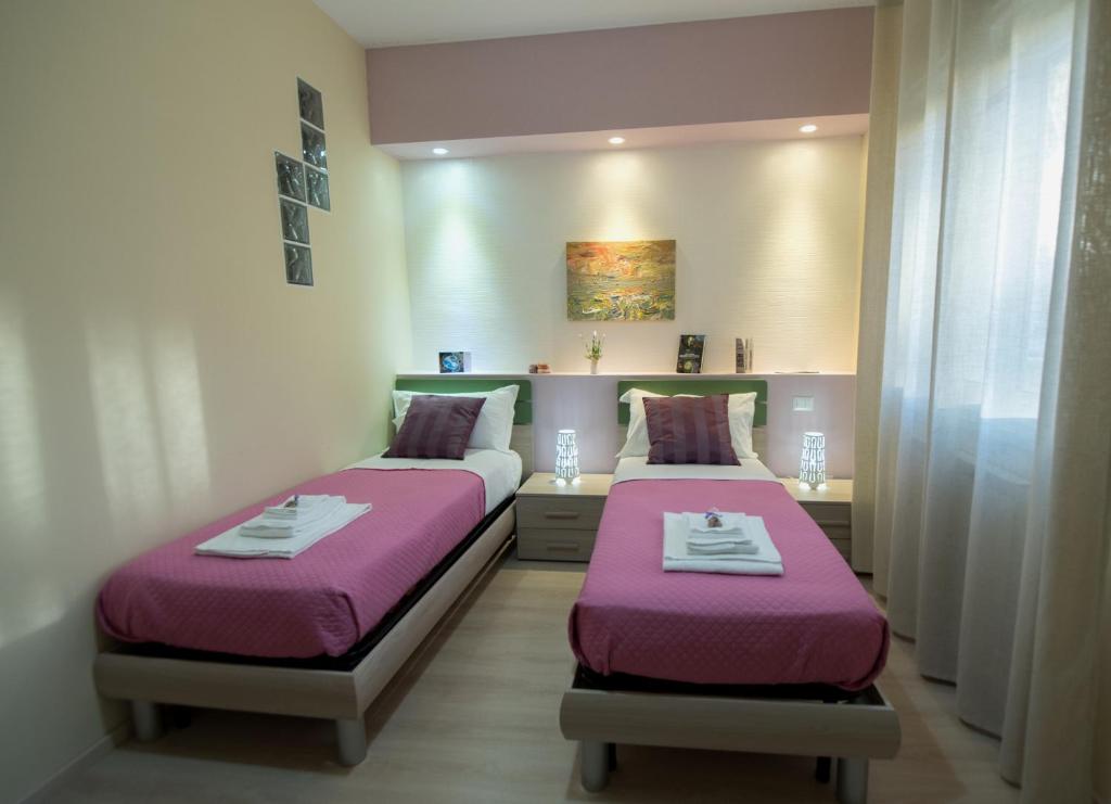 Postel nebo postele na pokoji v ubytování B&B Giunone