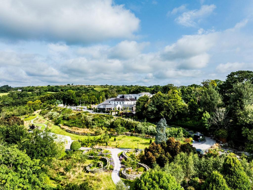 an aerial view of a large house in the forest at Fernhill Hotel & Estate in Clonakilty