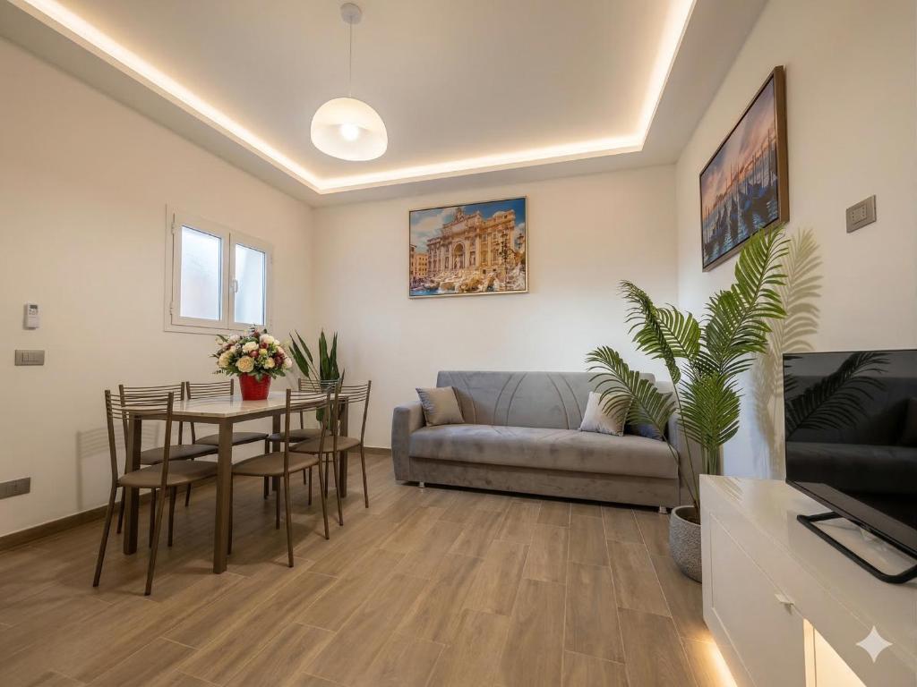 a living room with a couch and a table at Central Suite - Premium Villas in Giulianova
