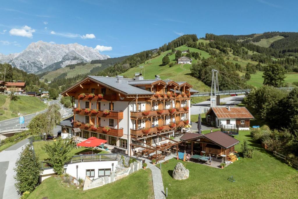 an aerial view of a hotel in the mountains at Hotel Bachschmied in Maria Alm am Steinernen Meer