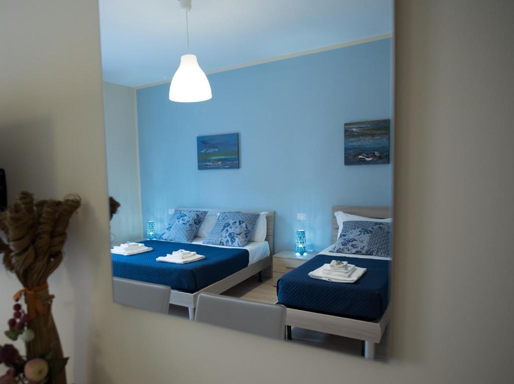 Postel nebo postele na pokoji v ubytování B&B Giunone