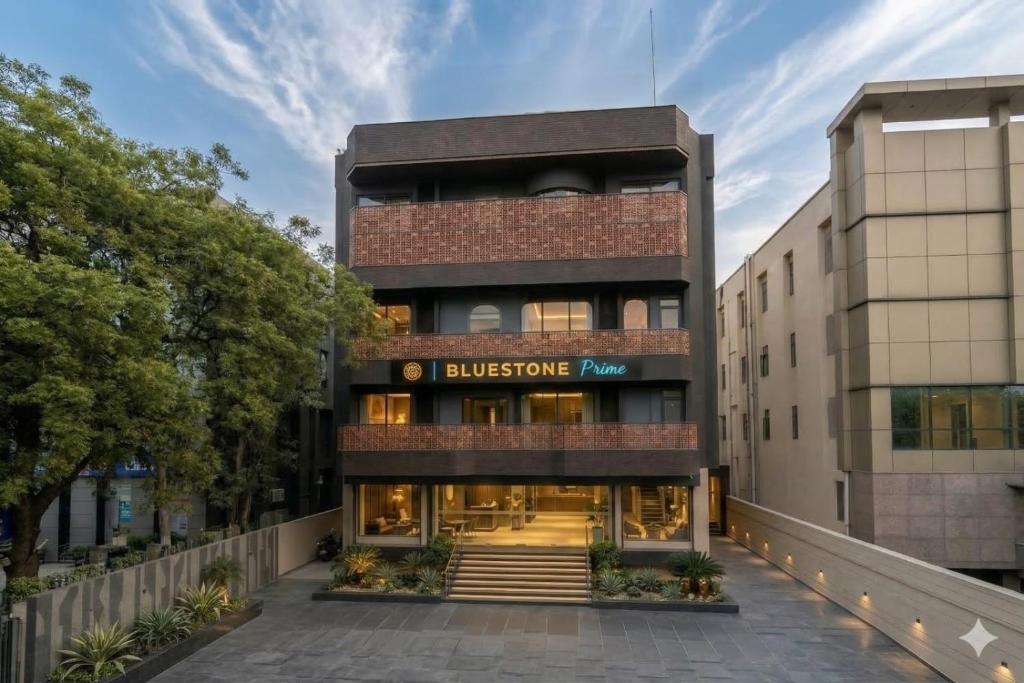 an office building with a sign that reads bullezume at Hotel Bluestone Prime Nehru Place by The Cosy hotels in New Delhi