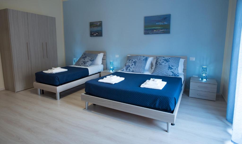 Postel nebo postele na pokoji v ubytování B&B Giunone