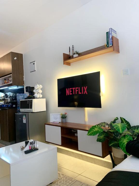 a netflix sign on the wall of a kitchen at Brizelle studio in Ongata Rongai 