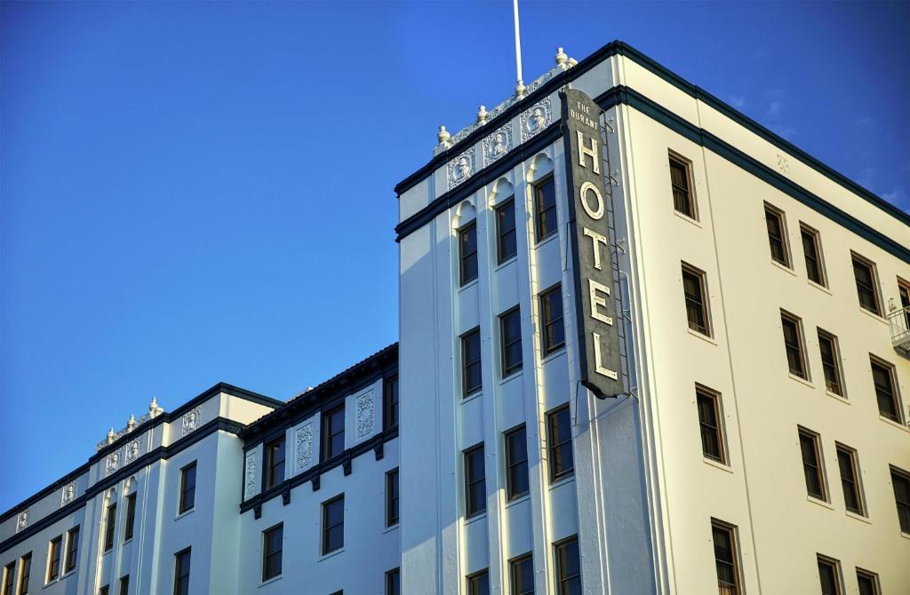 a white building with a sign on the top of it at Graduate by Hilton Berkeley in Berkeley