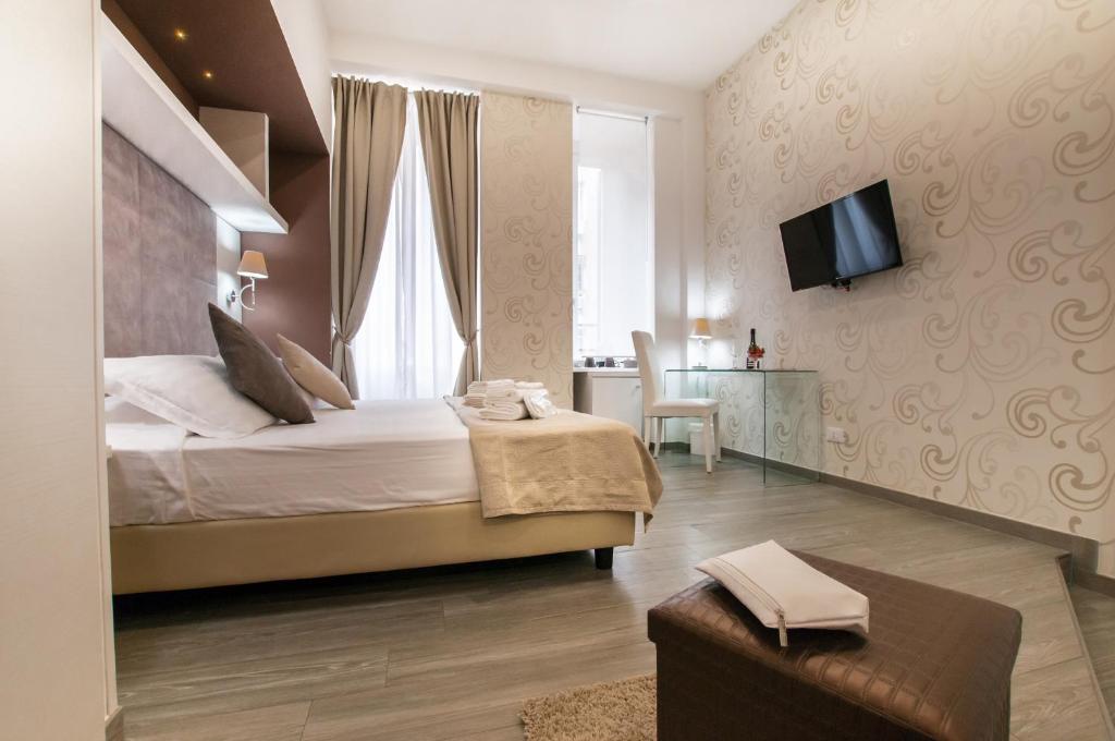 Łóżko lub łóżka w pokoju w obiekcie Elenoire Rooms & Suite