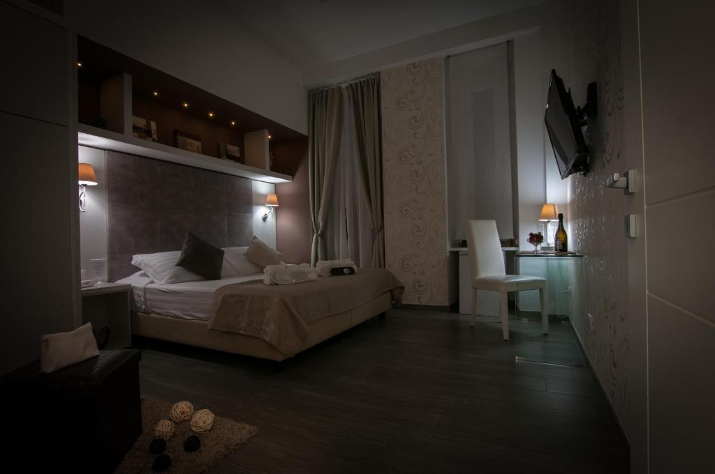 Łóżko lub łóżka w pokoju w obiekcie Elenoire Rooms & Suite