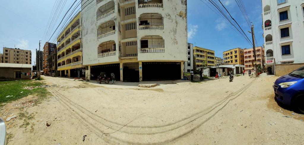 an empty street in front of a building at Mokaya Investments in Mombasa