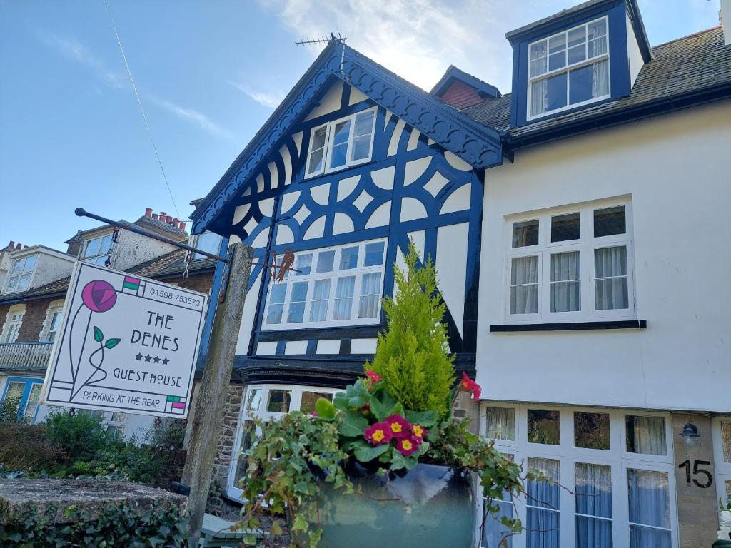 a blue and white building with a sign in front of it at The Denes Guest House in Lynton