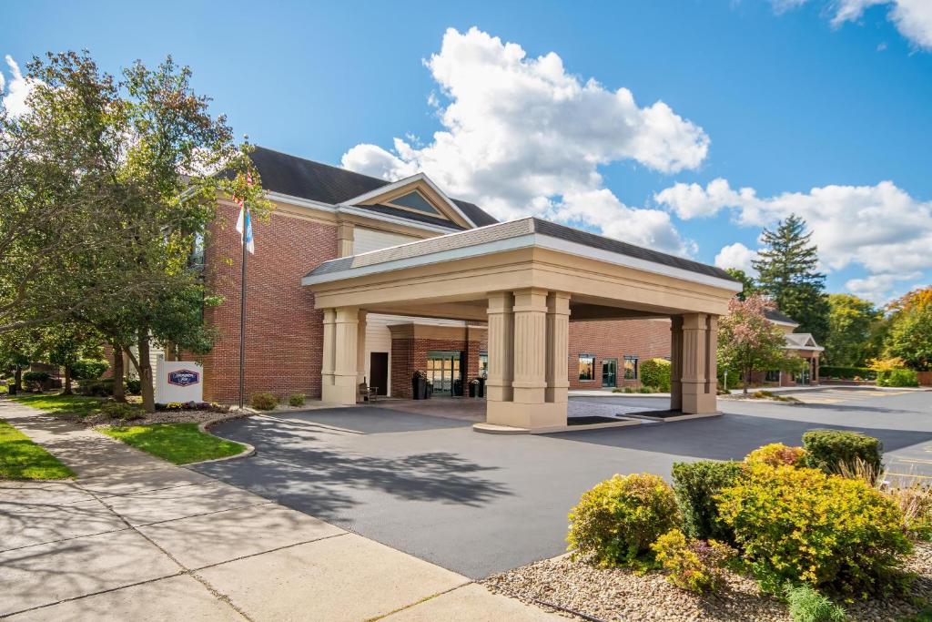 a brick building with a gazebo in front of it at Hampton Inn East Aurora, NY in East Aurora