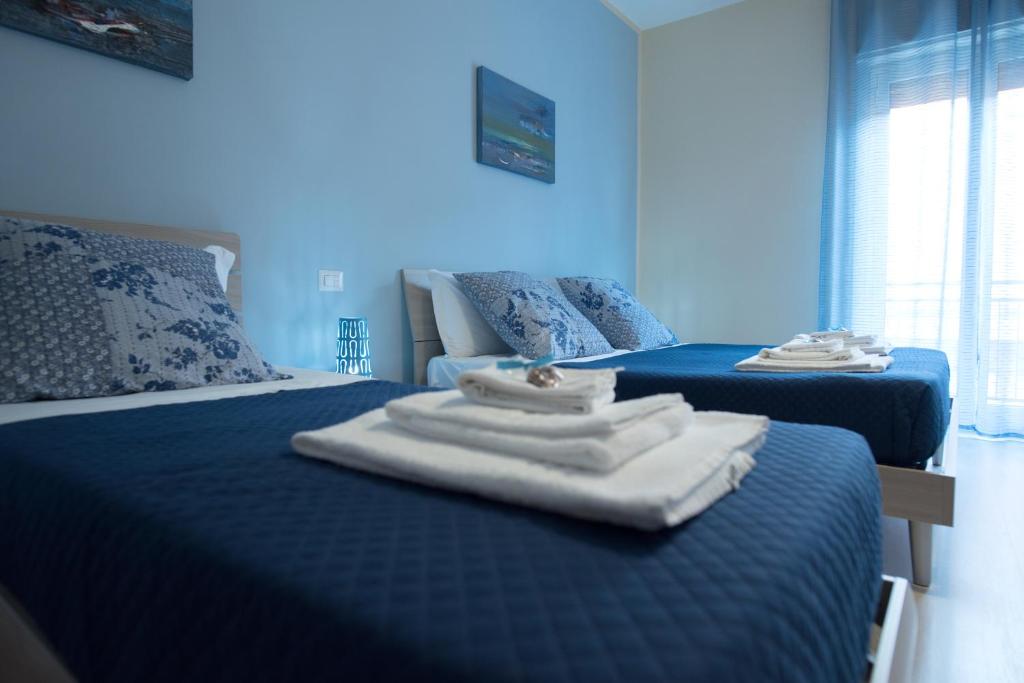 Postel nebo postele na pokoji v ubytování B&B Giunone