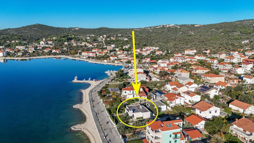 an aerial view of a town next to a lake at House Pazanin in Vinišće