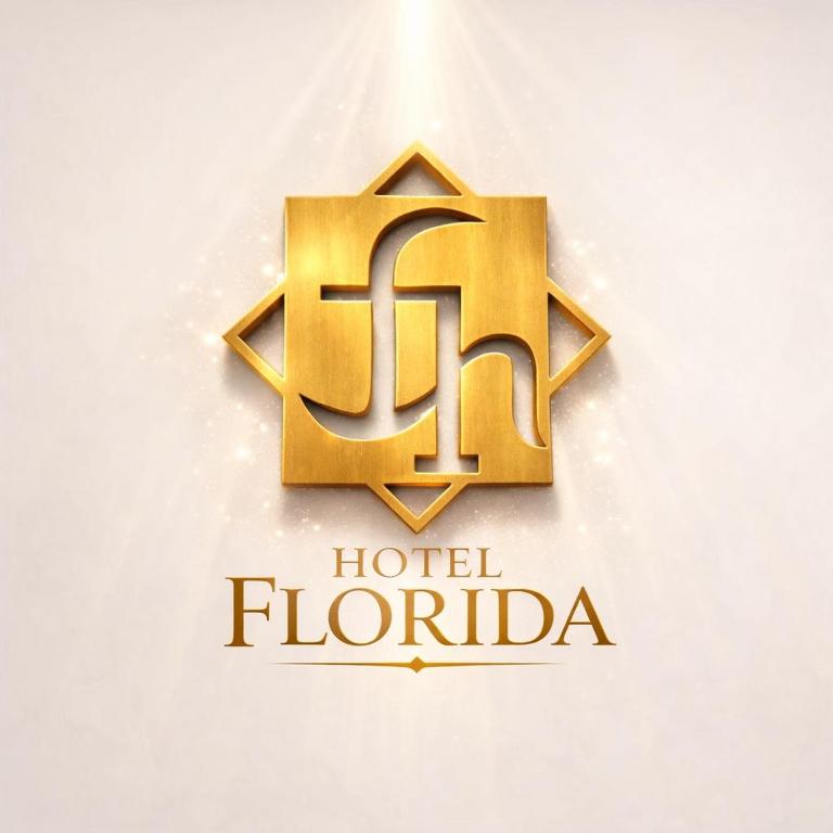 a golden logo for a hotel florida at Hotel Florida in Concordia