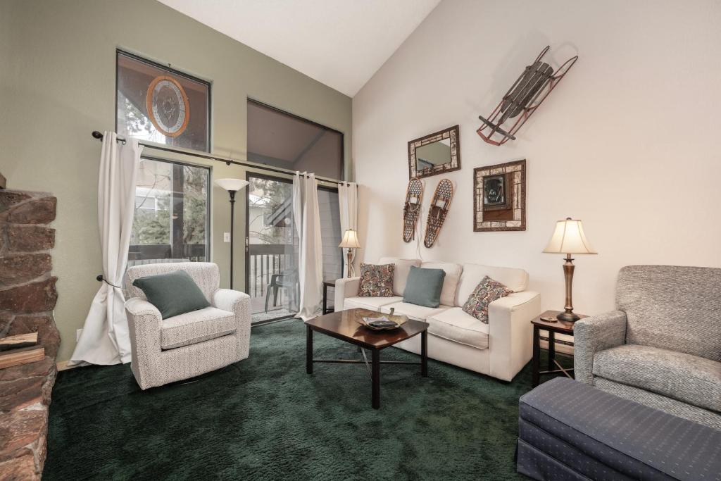 a living room with a couch and chairs and a table at Sun Song 3F in Fraser