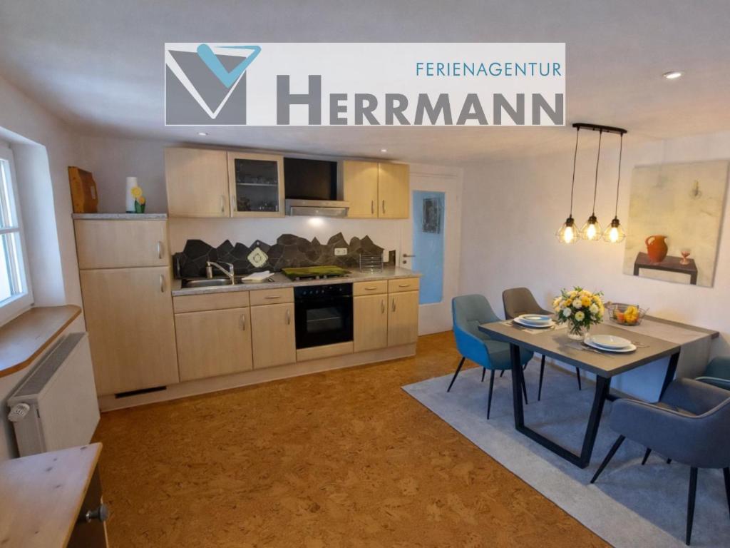 a kitchen and dining room with a table and chairs at Ferienwohnung 19 Gipfelblick in Schwangau
