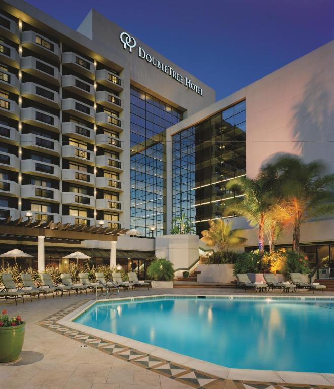 a swimming pool in front of a hotel at DoubleTree by Hilton San Jose in San Jose