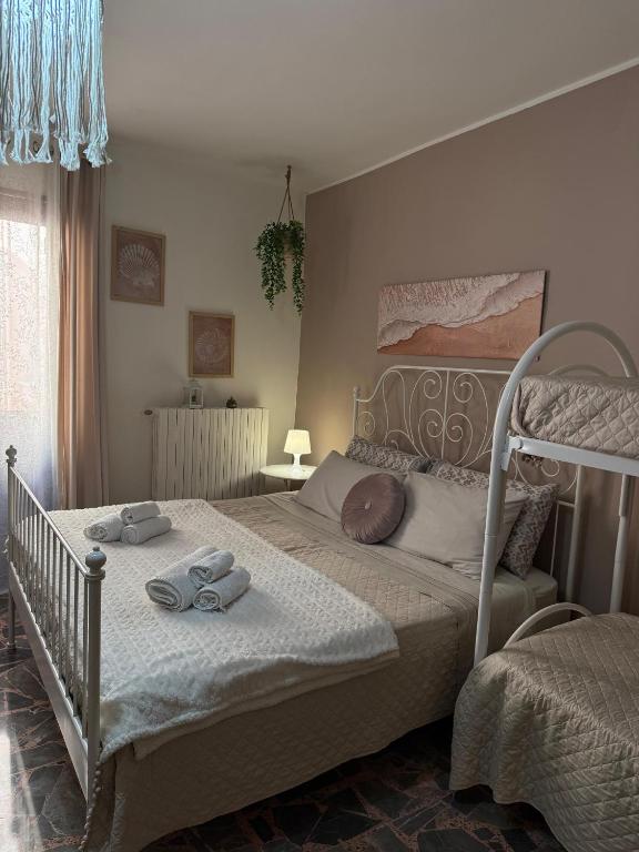 a bedroom with a bed with towels on it at Al Bastione B&B in Barletta