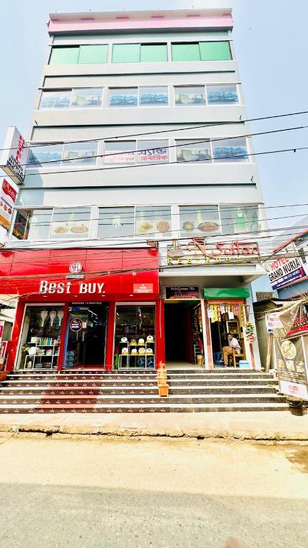 a best buy building with stairs in front of it at Hotel Grand Nuria in Habiganj