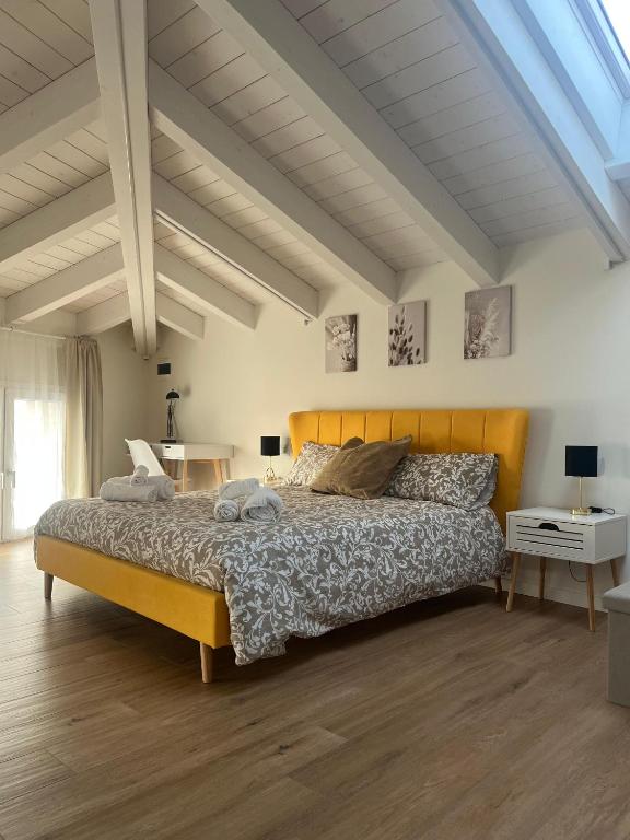 a bedroom with a large bed in a room at b&b Civico 30 in Lonato
