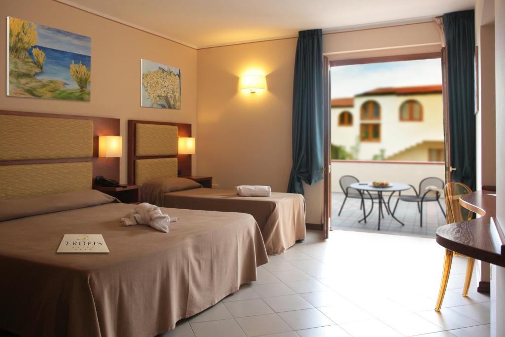 Postel nebo postele na pokoji v ubytování Hotel Tropis