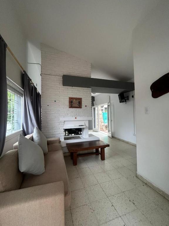 a living room with a couch and a table at Casa Kempes in Córdoba
