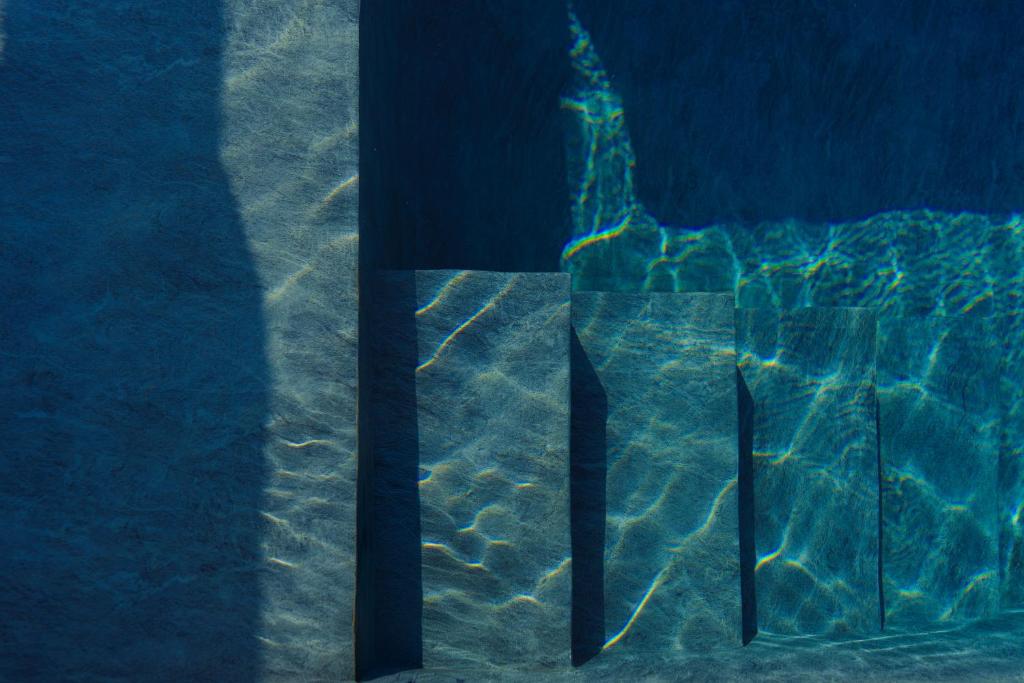 a reflection of a building in a pool of water at Villa Magliolo Panoramic Luxury Retreat in Cefalù