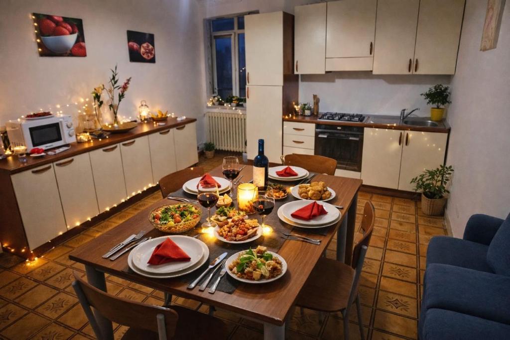 a table with plates of food on it in a kitchen at "Babbo" Nicola in Salve