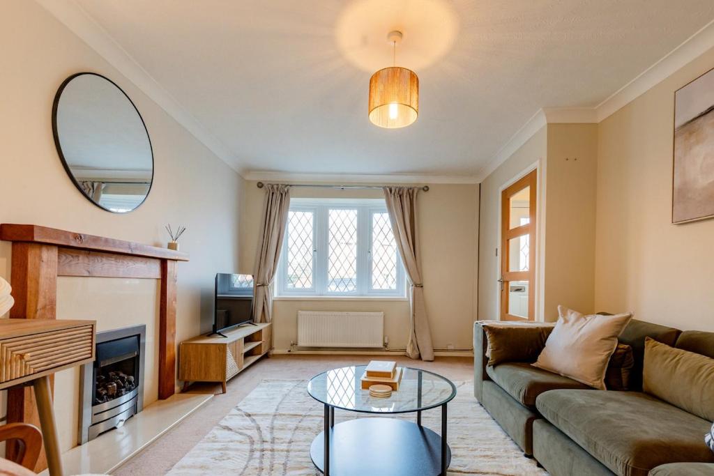 a living room with a couch and a table at Drovers Way, Worcester in Fernhill Heath