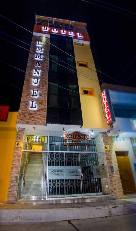 a building with a sign on top of it at Hotel Emmanuel in Chepén
