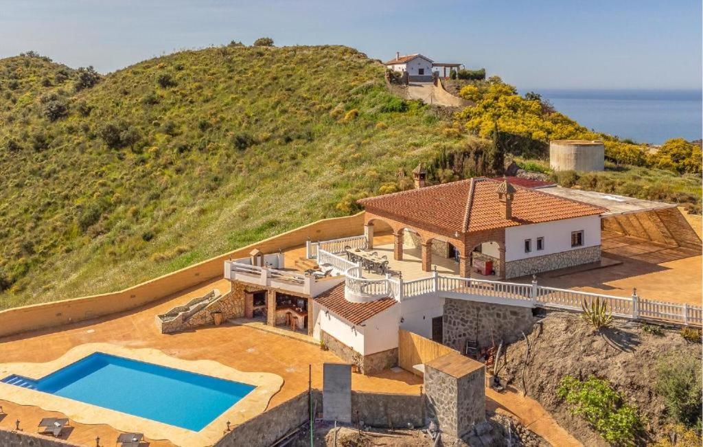 an aerial view of a house with a swimming pool at Villa La Colina in Torrox