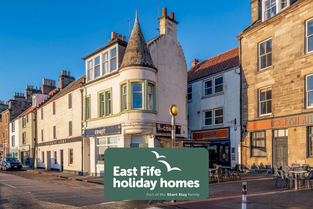 a sign that says east fire holiday homes on a city street at Harbour View - Anstruther in Anstruther