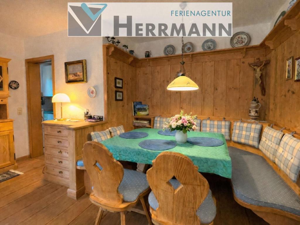 a dining room with a table and two chairs at Bei der Vils in Pfronten