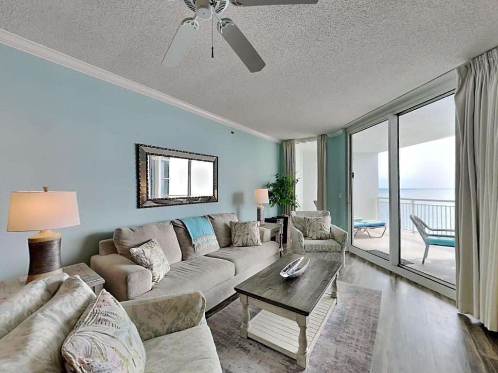 a living room with a couch and a table at Palacio #1003 in Perdido Key