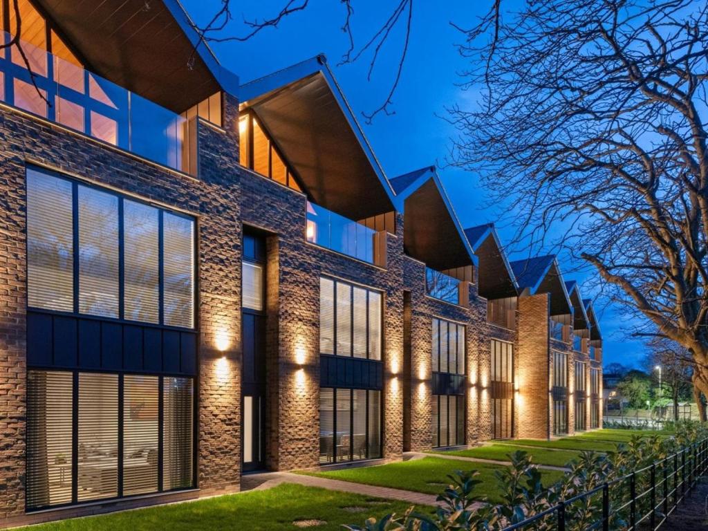 an exterior view of a brick building with lights at 4 Bed in Morpeth oc-93775 in Thropton