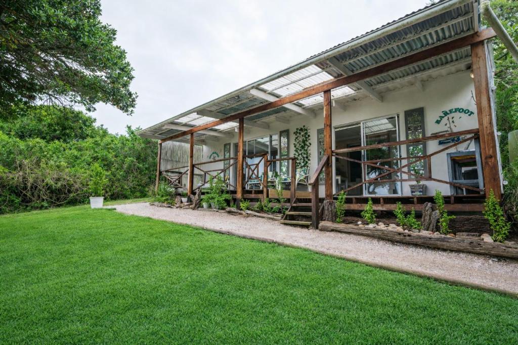 a house with a green lawn in front of it at 302 On Old Sea View Road Chelsea in Port Elizabeth