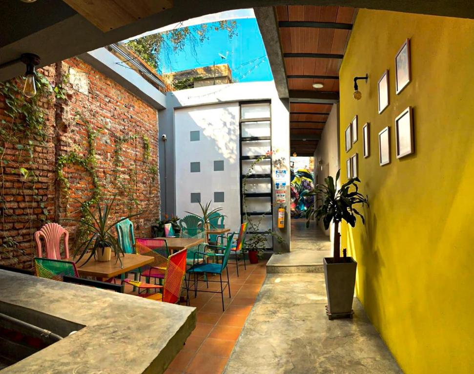 a restaurant with a table and chairs in a room at Casa Imagine in Santa Marta