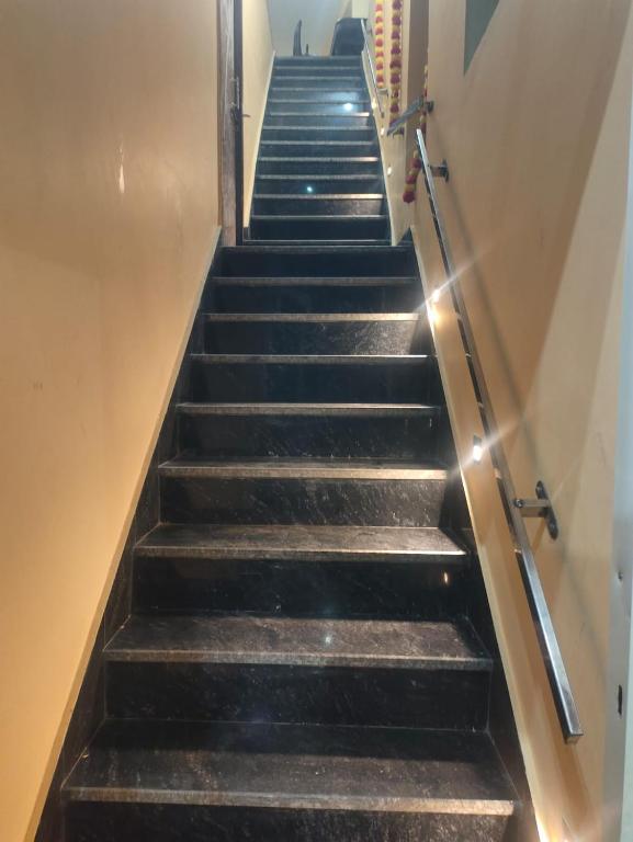 a flight of stairs in a building at Pushpkali Seva Sadan in Mathura