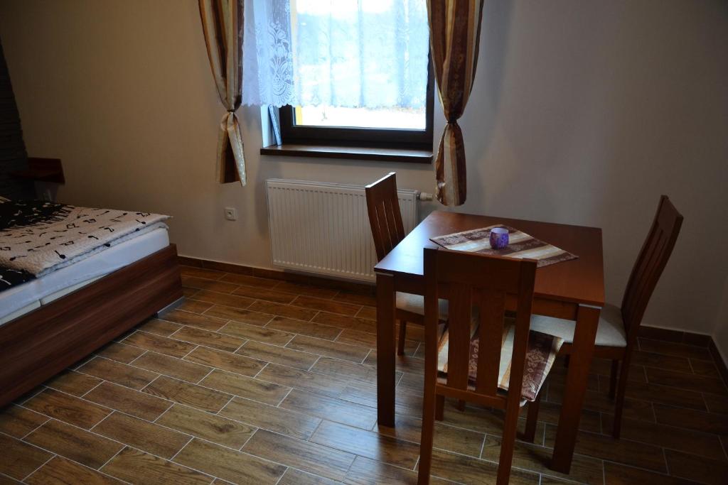 Postel nebo postele na pokoji v ubytování Apartmány Nad řekou