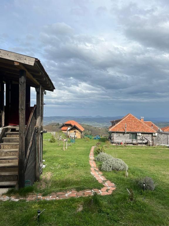 a house with a path leading to a field at Šebovina Jelova gora in Starčevići