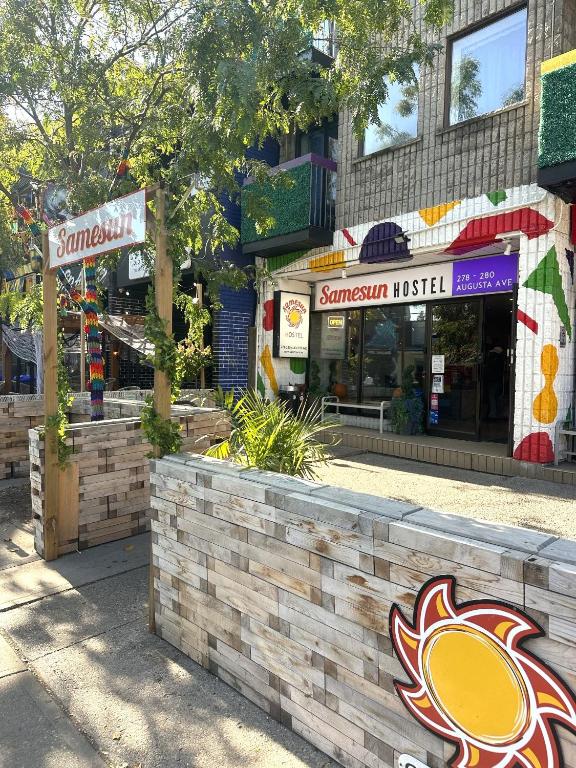 a store front of a street with a restaurant at Samesun Toronto in Toronto