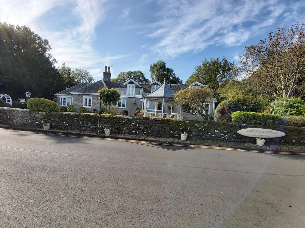 a house on the side of a road at Waters Edge Cottage in Alexandria