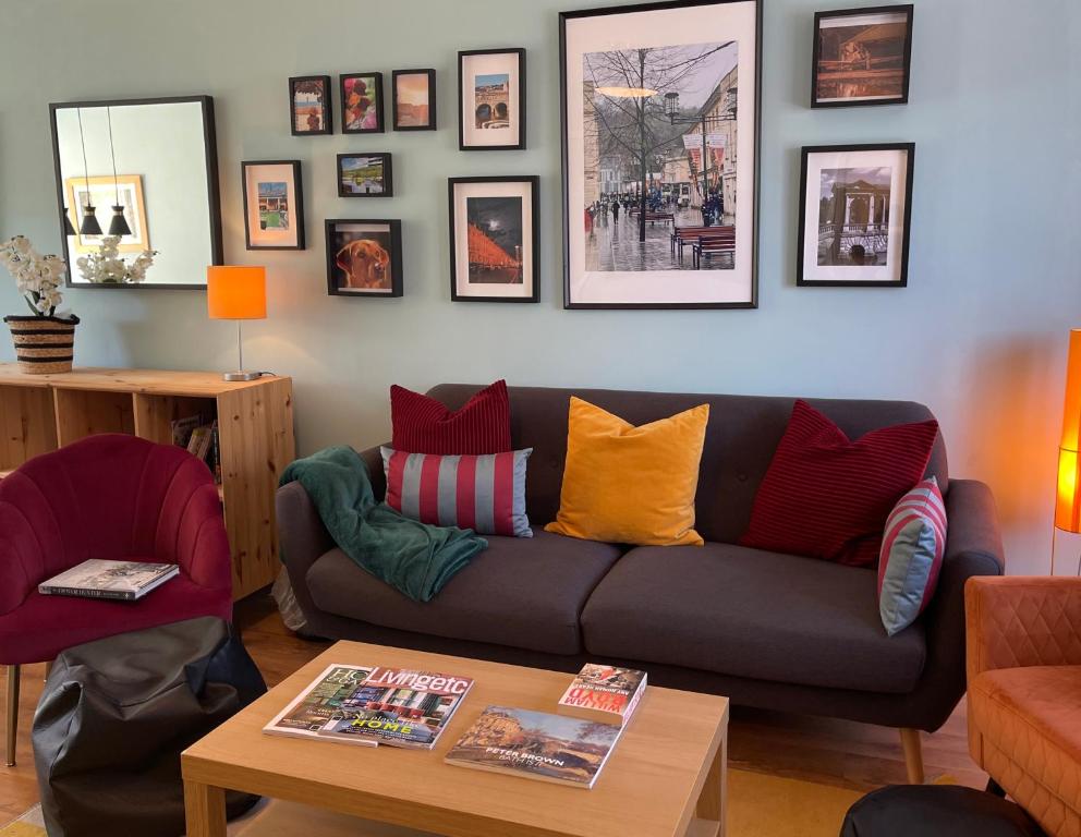 a living room with a couch and a table at Peaceful 2 Bed Home with Parking Fast WIFI Easy Stress-Free Access to Bath in Bath