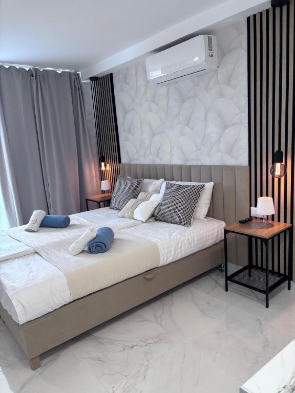 a bedroom with a large bed with a wall at Blue Ocean Costa Adeje 502 in Playa de las Americas