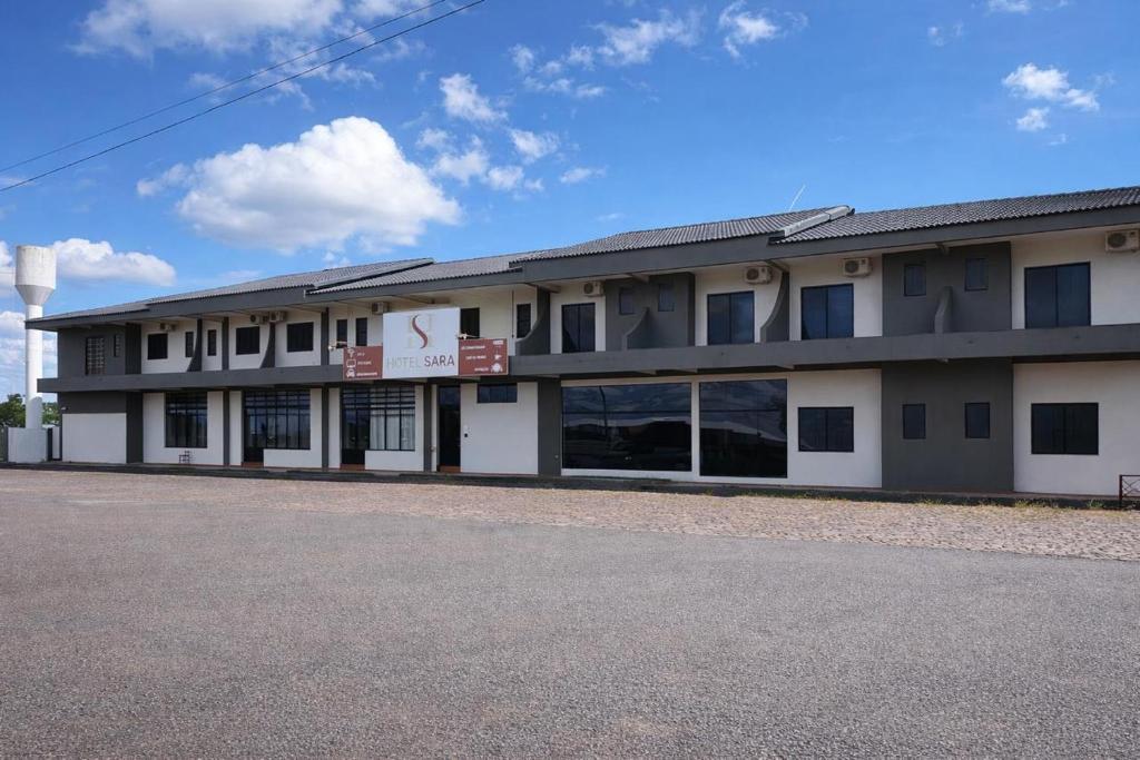 a large building with a lot of windows at Hotel Sara - Ampere in Ampère