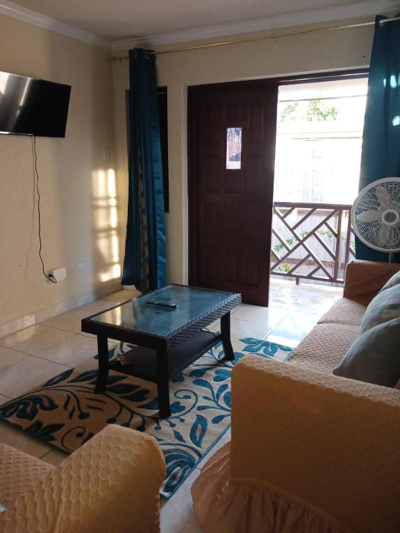 a living room with a couch and a coffee table at Turtle Bay in Bridgetown