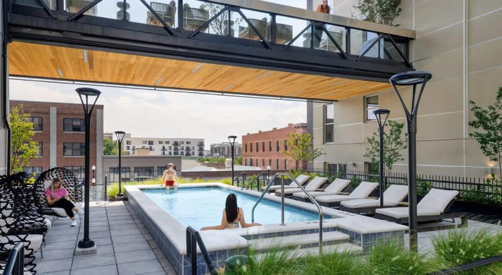 a swimming pool on the roof of a building at Luxury Central City Escape in Salt Lake City