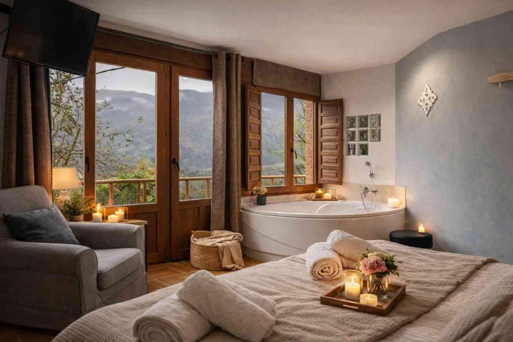 a bedroom with a large bed and a bath tub at El Ablanu, jacuzzi y vistas in Proaza