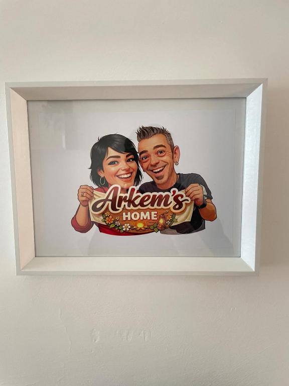 a picture of a couple holding a pretzel at Arkem's home in Norma