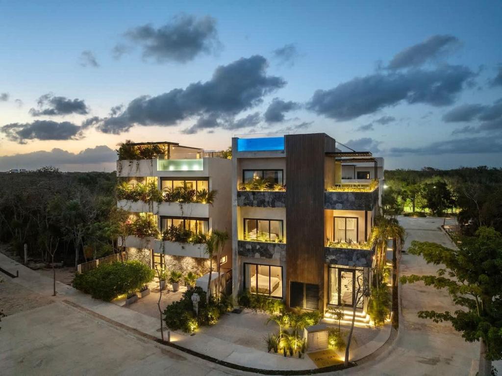 an aerial view of a building at dusk at Twin Luxury Villas - Groups Prstigia MX in Tulum