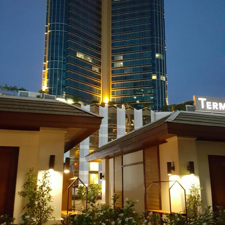 a view of a building with a tall skyscraper at W 21 Hotel Bangkok in Bangkok